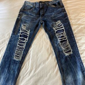 Ripped dark blue jeans